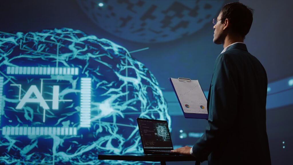 Male professional analyzing data charts with a clipboard and laptop in front of a large digital AI brain interface, representing artificial intelligence and data science in a tech environment.